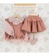Conjunto niña rosa viejo blusa estampada chaleco volantes y falda tejido suave elegante