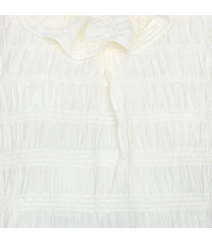 Textura del conjunto Pololo bebé cuadros verde invierno blusa cruda textura labrada cuello volante algodón detalle elegante