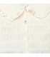 Detalle de textura del conjunto pantalón niña cuadros verde invierno blusa cruda textura labrada cuello volante detalle elegante