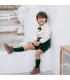 Niño con el conjunto pololo bebé verde elegante con camisa blanca pajarita y pantalón corto tejido suave invierno