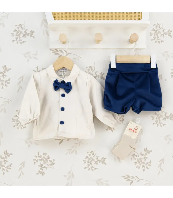 Conjunto Pololo bebé azul marino elegante con camisa blanca pajarita y pantalón corto tejido suave invierno