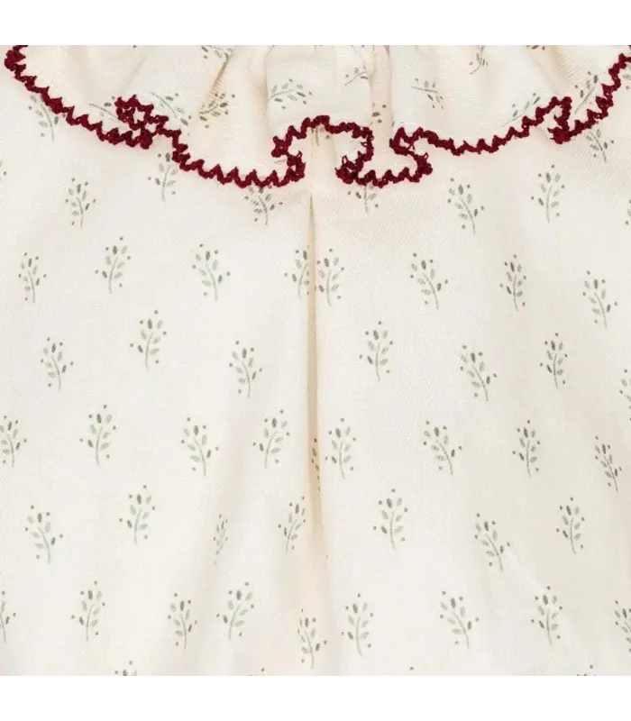 Detalle del pelele bebé crudo algodón estampado cuello volante detalle contraste