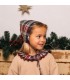Niña con el capota bebé granate cuadros algodón lazos laterales detalle clásico invierno elegante