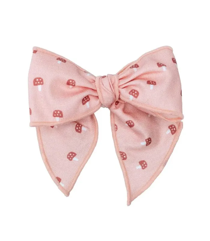 Lazo Pelo bebé rosa empolvado con estampado suave y pinza detalle delicado infantil en fondo blanco