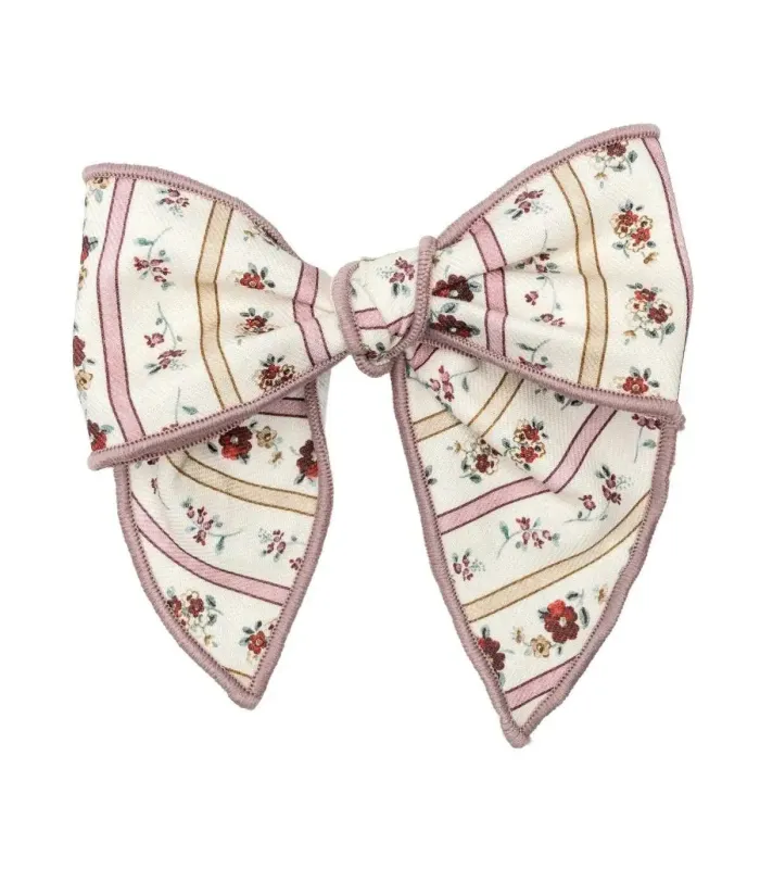 Lazo Pelo bebé nude floral pinza tela suave ribete rosa empolvado detalle elegante en fondo blanco