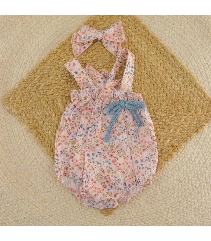 Peto bebé niña rosa Calamaro Poniente de algodón con estampado floral y lazo azul