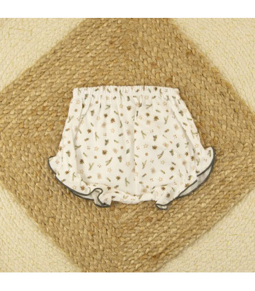 Braguita de niña estampada con motivos navideños de pinos, estrellas y adornos en tonos beige y verde de Calamaro