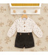 Conjunto bebé navideño con blusa estampada y pololo de pana oscuro. Fondo estudio.